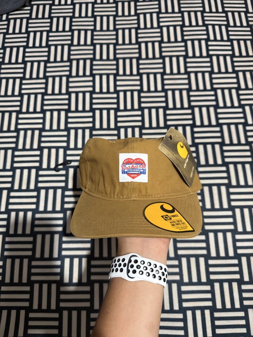 Carhartt WIP Force Cap Brown with Heart Patch (Category: Caps & Hats) located in Manila. Submitted by garcianath68674 (Listing ID 1469285556, Image 1). Description: - Brand new with original tags attached - Color: Classic brown canvas - Rare special edition heart patch logo on the front - Built-in Force sweatband wicks sweat and dries fast - Adjustable strap closure with iconic Carhartt yellow logo tag - One size fits all.