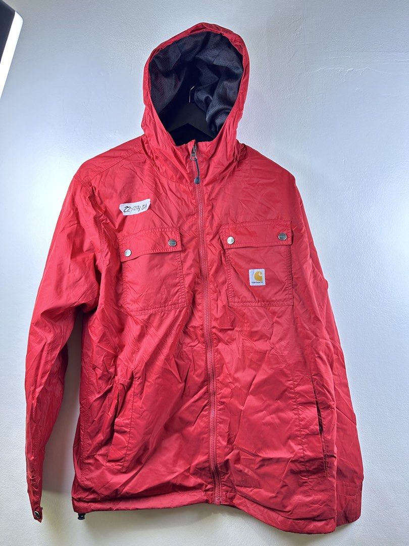 Carousell Carhartt Red Hooded Zip Jacket (Category: Coats, Jackets and Outerwear) located in Manila. Submitted by declutterpromax (Listing ID 1469223225, Image 1). Description: - Brand: Carhartt - Color: Bright red - Features: YKK front zipper closure, dual chest flap pockets with branded snap buttons, mesh-lined hood - Details: Iconic Carhartt logo patch on the lower left pocket - Measurements: 22" (chest) x 24" (length) x 21" (sleeves) - Style: