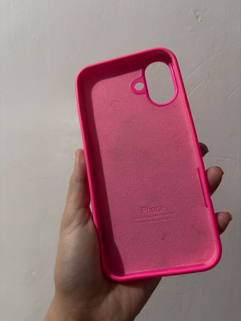 Case for iPhone 16 Plus (Category: Cases & Sleeves) located in Taguig. Submitted by vashtardo (Listing ID 1469210999, Image 3). Description: - Compatible Model: iPhone 16 Plus - Material: Premium smooth silicone with soft microfiber interior lining - Features: Vibrant color options (pink, purple, clear), MagSafe ring design, and matching wrist strap for secure carrying - Condition: Used and in good condition - Protection: Full coverage protection