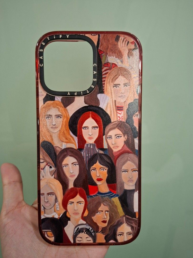 Casetify for Iphone 16 Pro Max (Category: Cases & Sleeves) located in Mandaluyong City. Submitted by k__z__ (Listing ID 1469163083, Image 1). Description: - Brand: Casetify - Compatibility: iPhone 16 Pro Max - Design: Artistic women faces print (one of Heart E's designs) with signature Casetify camera ring branding - Features: MagSafe compatible inner ring - Condition: Excellent, pre-loved - via shipping only -Used only a few times since 2 months