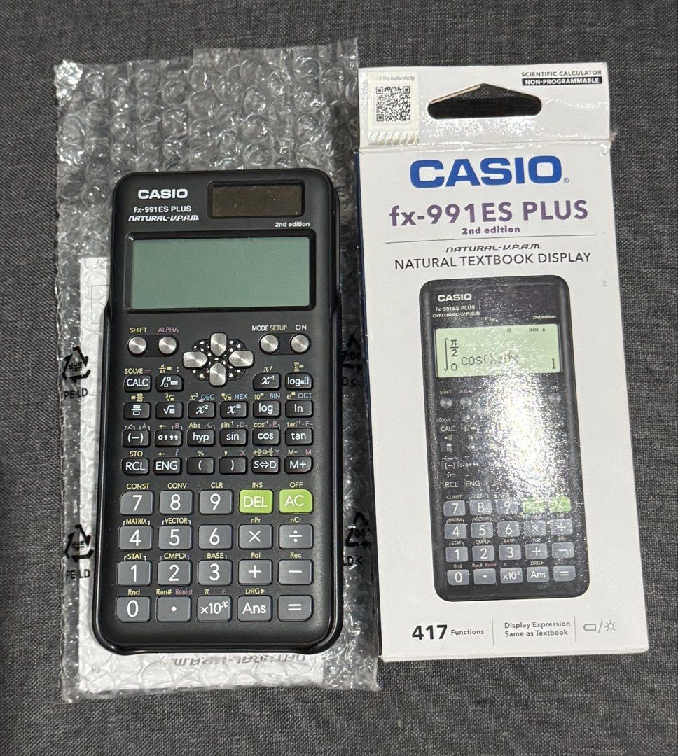 Casio fx-991ES Plus 2nd Edition Scientific Calculator (Category: Office & Business Technology) located in Manila. Submitted by pheta (Listing ID 1469194995, Image 1). Description: - Model: Casio fx-991ES Plus 2nd Edition (Non-programmable, exam-friendly) - Functions: 417 built-in functions with Natural Textbook Display - Ideal For: Secondary school, high school, and university students - Condition: Brand new in box with original bubble wrap inclu
