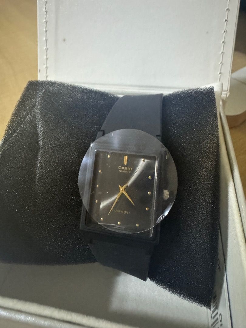 Casio Quartz Black Rectangular Watch in Box (Category: Women's Watches) located in Pasig City. Submitted by daryl.s.preloved_ (Listing ID 1469274852, Image 1). Description: - Brand: Casio - Condition: Brand new, never worn with plastic protective film still on the face - Dial: Rectangular black dial with elegant gold hands - Strap: Simple and classic black strap - Packaging: Comes complete in its original white Casio presentation box on a black d