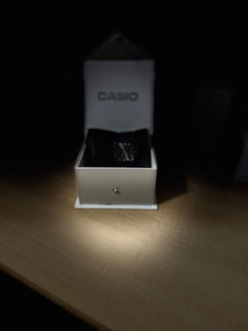 Casio Quartz Black Rectangular Watch in Box (Category: Women's Watches) located in Pasig City. Submitted by daryl.s.preloved_ (Listing ID 1469274852, Image 3). Description: - Brand: Casio - Condition: Brand new, never worn with plastic protective film still on the face - Dial: Rectangular black dial with elegant gold hands - Strap: Simple and classic black strap - Packaging: Comes complete in its original white Casio presentation box on a black d