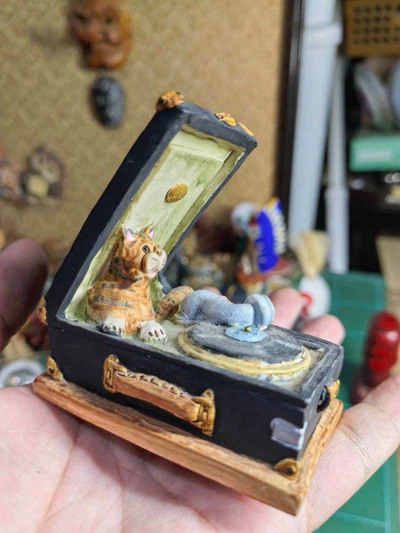 Cat DJ & Gramophone Figurine (Category: Other Home Decor) located in Cebu City. Submitted by dudes_villanueva (Listing ID 1469275418, Image 3). Description: Cat DJ & Gramophone Figurine / Trinket Box In excellent condition -Hand-painted novelty figurine/decor piece featuring a tabby cat sitting inside an open vintage suitcase-style gramophone turntable ​-Detailed miniature scene with a vinyl record, tone arm, and side stack of books/accessories S