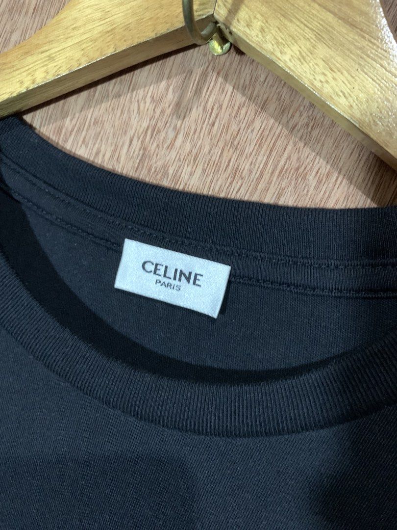 Celine Black Embroidered Triomphe T-Shirt (Category: Shirts) located in Tacurong. Submitted by ljsthrift (Listing ID 1469177346, Image 3). Description: - Brand: Celine - Color: Black with blue embroidered Triomphe logo on the chest - Size: Medium (indicated on inner tag) - Fit: Classic fit, short sleeves - Material: Premium cotton - Condition: Excellent, with woven neck and care labels intact.