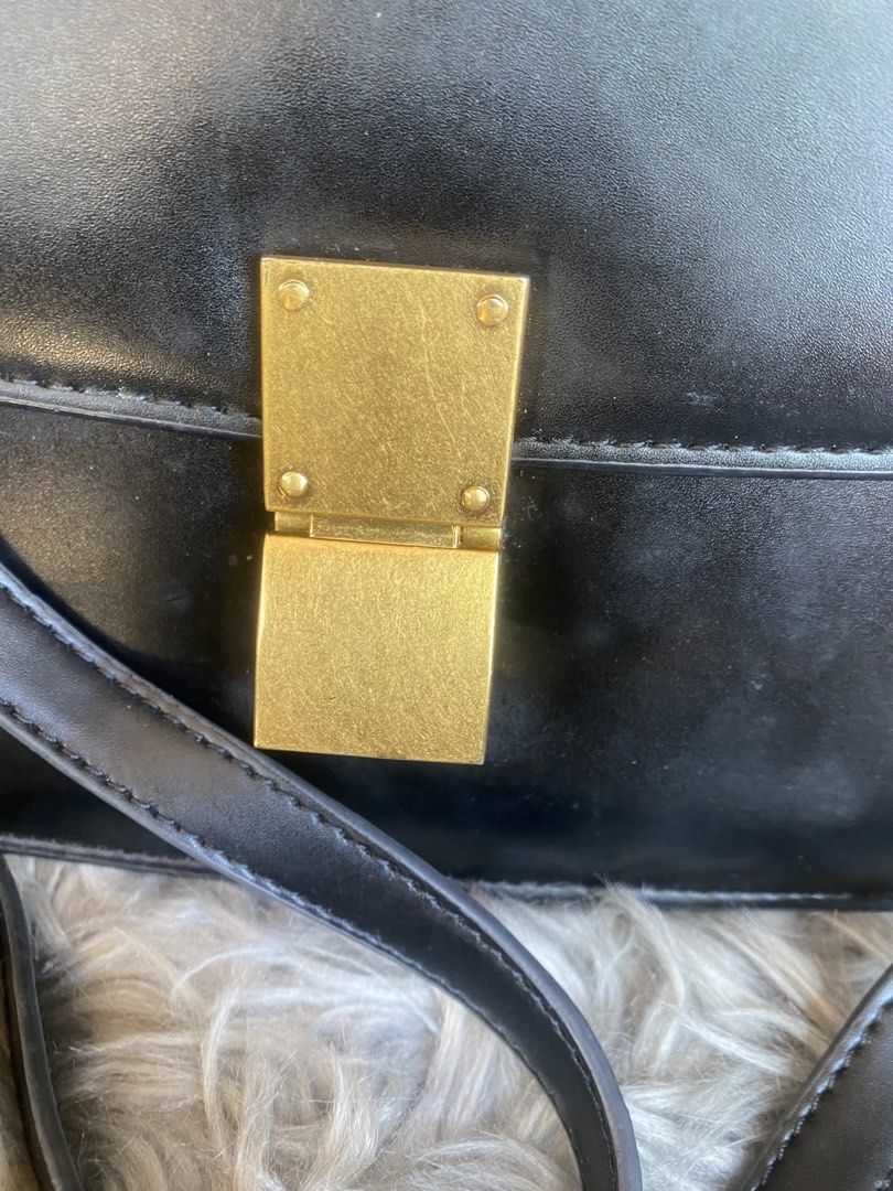 Celine Paris Black Box Calfskin Medium Classic Bag (Category: Luxury Bags & Wallets) located in Bacolod City. Submitted by chuchaystuffs (Listing ID 1469168166, Image 2). Description: - Celine Paris classic box bag - Crafted from premium smooth black leather - Structured accordion gusset sides with multiple interior compartments - Elegant gold-tone hardware and signature clasp closure - Features an adjustable shoulder strap for versatile wear - S