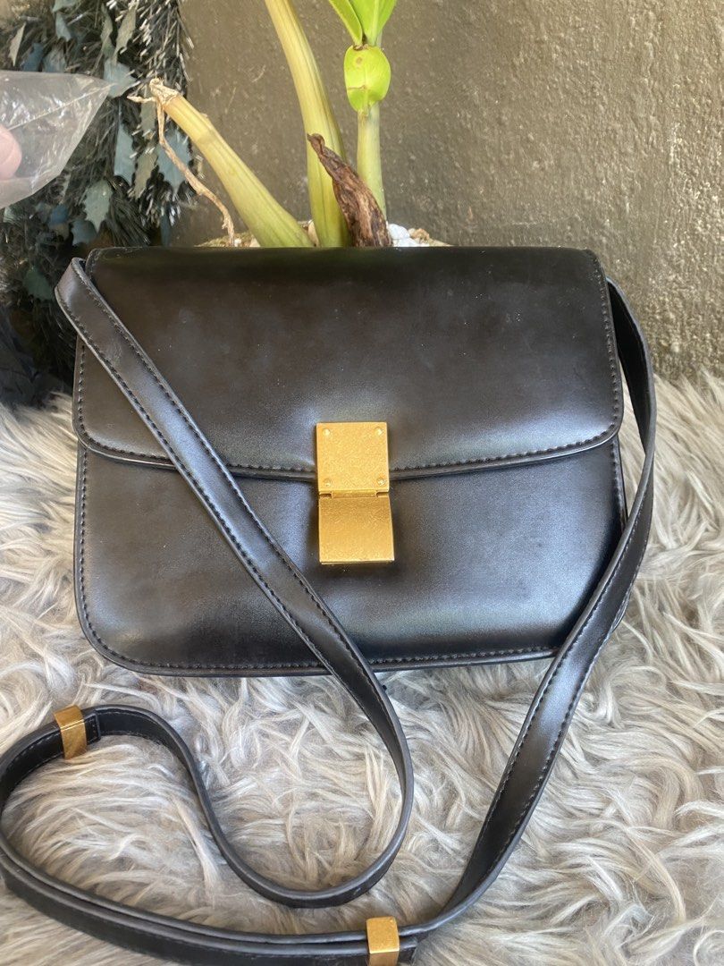 Celine Paris Black Box Calfskin Medium Classic Bag (Category: Luxury Bags & Wallets) located in Bacolod City. Submitted by chuchaystuffs (Listing ID 1469168166, Image 1). Description: - Celine Paris classic box bag - Crafted from premium smooth black leather - Structured accordion gusset sides with multiple interior compartments - Elegant gold-tone hardware and signature clasp closure - Features an adjustable shoulder strap for versatile wear - S
