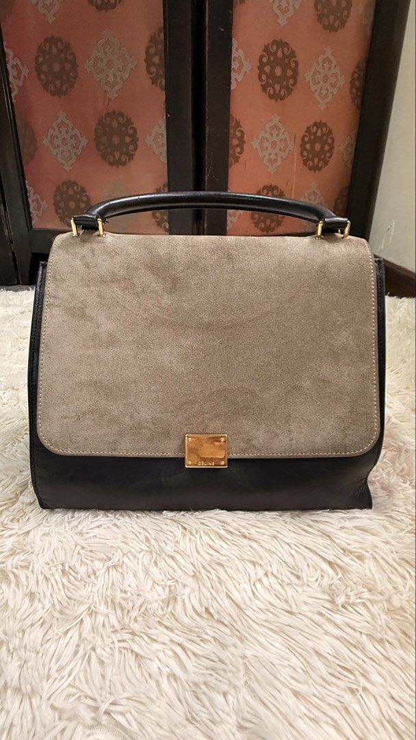 Celine Tricolor Trapeze Bag (Category: Luxury Bags & Wallets) located in Pasay City. Submitted by erinsclosetph (Listing ID 1469292142, Image 2). Description: Celine Tricolor Trapeze Bag Beautiful Celine Trapeze in a chic combination of navy blue, light brown suede, and black leather. Comes with a detachable leather shoulder strap for versatile styling. Color: Navy blue, light brown suede, and black Condition: Pre-loved with signs of wear Hardwar