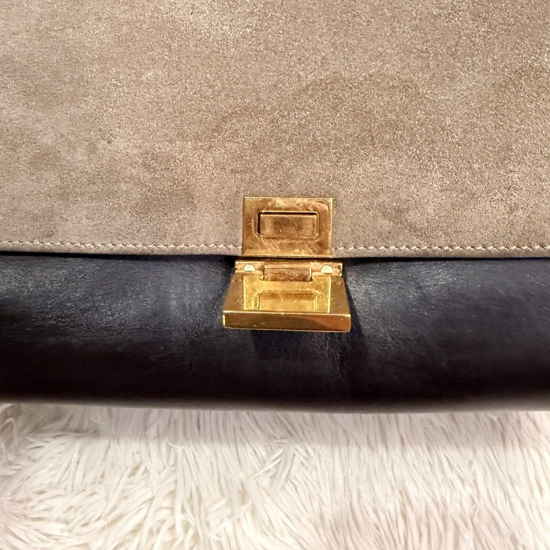 Celine Tricolor Trapeze Bag (Category: Luxury Bags & Wallets) located in Pasay City. Submitted by erinsclosetph (Listing ID 1469292142, Image 3). Description: Celine Tricolor Trapeze Bag Beautiful Celine Trapeze in a chic combination of navy blue, light brown suede, and black leather. Comes with a detachable leather shoulder strap for versatile styling. Color: Navy blue, light brown suede, and black Condition: Pre-loved with signs of wear Hardwar