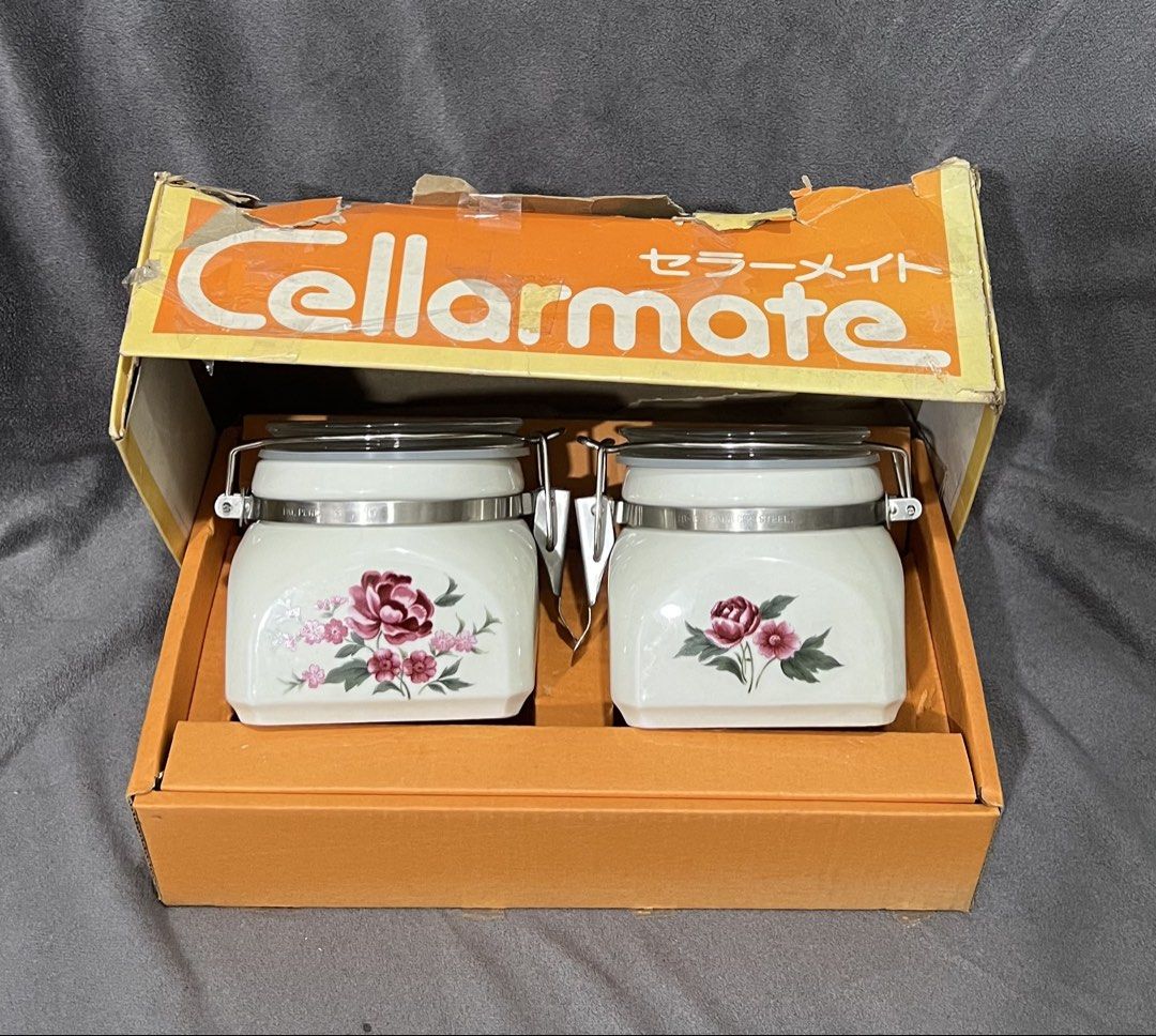 Cellarmate Ceramic Airtight Jars Set with Floral Pattern Original Box (Category: Food Organization & Storage) located in Las Pinas. Submitted by maple0305 (Listing ID 1469307429, Image 1). Description: - Brand: Cellarmate - Set includes: 2 ceramic jars with glass lids and metal locking clamps - Design: White finish with charming pink and red floral illustrations - Condition: Complete with original orange branded box, packaging inserts, and paper 
