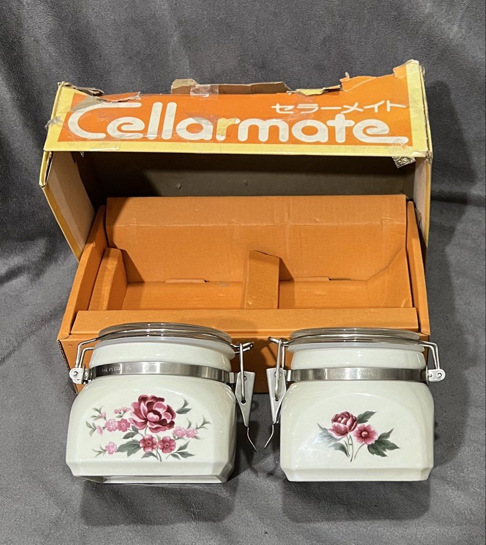 Cellarmate Ceramic Airtight Jars Set with Floral Pattern Original Box (Category: Food Organization & Storage) located in Las Pinas. Submitted by maple0305 (Listing ID 1469307429, Image 2). Description: - Brand: Cellarmate - Set includes: 2 ceramic jars with glass lids and metal locking clamps - Design: White finish with charming pink and red floral illustrations - Condition: Complete with original orange branded box, packaging inserts, and paper 
