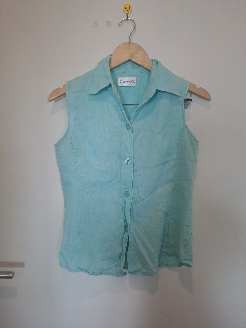 Chadwick 100% linen (Category: Sleeveless) located in Manila. Submitted by joanbalde39643 (Listing ID 1469204768, Image 1). Description: The garment in the image is a vintage Chadwick's sleeveless button-up blouse. It features a pointed spread collar, a structured front button placket with matching translucent buttons, and vertical shaping darts down the bodice for a tailored fit..