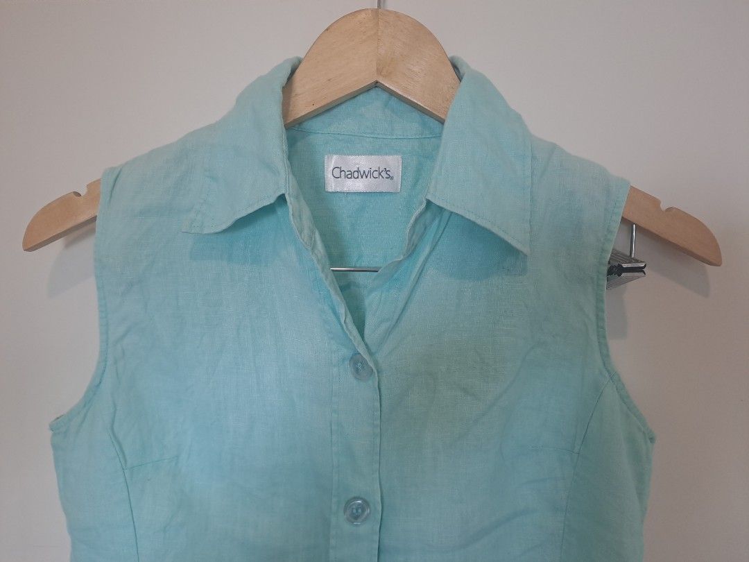 Chadwick 100% linen (Category: Sleeveless) located in Manila. Submitted by joanbalde39643 (Listing ID 1469204768, Image 2). Description: The garment in the image is a vintage Chadwick's sleeveless button-up blouse. It features a pointed spread collar, a structured front button placket with matching translucent buttons, and vertical shaping darts down the bodice for a tailored fit..