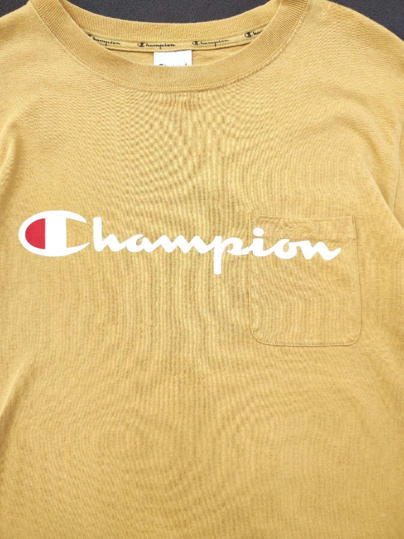 Champion Beige Pocket Tee (Category: Tshirts & Polo Shirts ) located in Bulacan. Submitted by emilj23 (Listing ID 1469169564, Image 2). Description: Champion Beige Pocket Tee Size M on tag L 26.5 W 19 Condition 9/10 Color rate 9/10 Issue Minimal Stain.