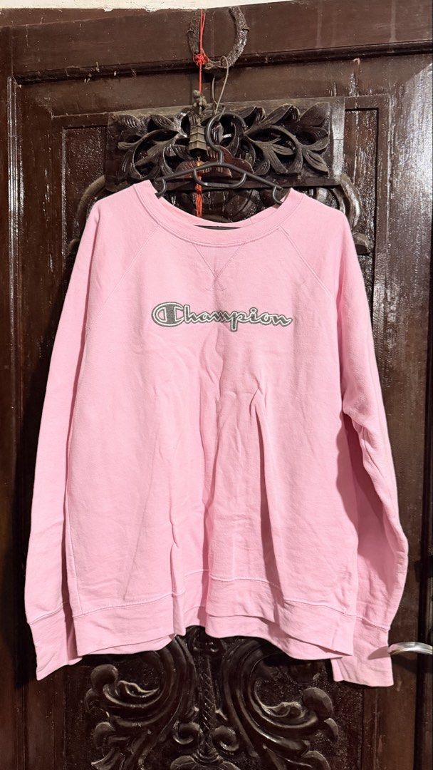 Champion Pink Script Logo Crewneck Sweatshirt Size XL (Category: Coats, Jackets and Outerwear) located in Las Pinas. Submitted by aliah2703 (Listing ID 1469173637, Image 2). Description: - Brand: Champion - Color: Pink with embroidered cursive logo - Size: XL USA (Relaxed fit) - Material: Comfortable athletic fleece, Made in Honduras - Details: Ribbed cuffs, hem, collar, and classic V-stitch neckline - Condition: Excellent pre-owned condition.