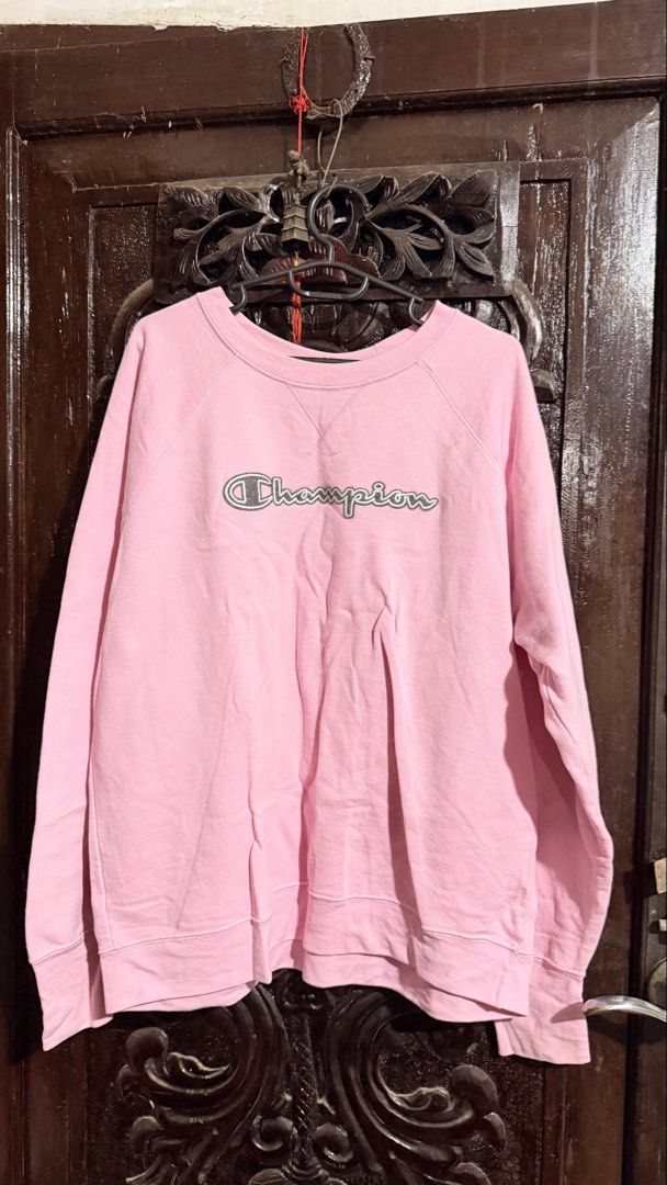 Champion Pink Script Logo Crewneck Sweatshirt Size XL (Category: Coats, Jackets and Outerwear) located in Las Pinas. Submitted by aliah2703 (Listing ID 1469173637, Image 1). Description: - Brand: Champion - Color: Pink with embroidered cursive logo - Size: XL USA (Relaxed fit) - Material: Comfortable athletic fleece, Made in Honduras - Details: Ribbed cuffs, hem, collar, and classic V-stitch neckline - Condition: Excellent pre-owned condition.