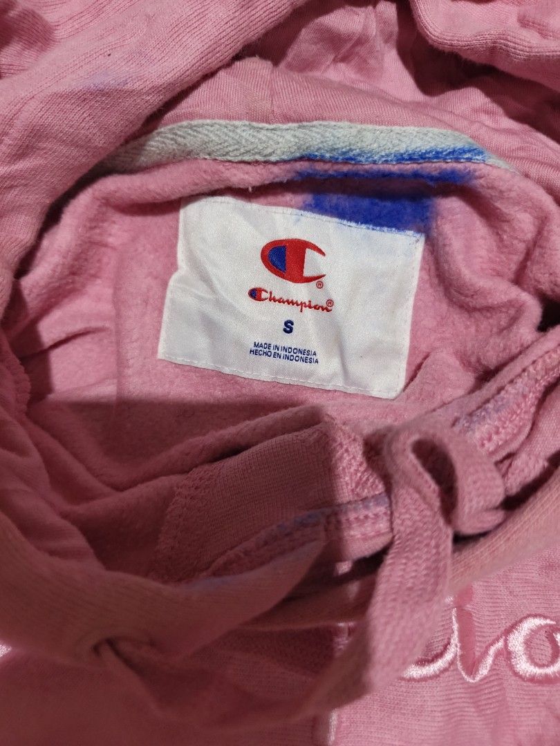 Champion Pink Script Logo Hoodie Size S (Category: Coats, Jackets and Outerwear) located in Davao. Submitted by romelyap (Listing ID 1469180463, Image 3). Description: - Brand: Champion - Color: Pink with embroidered script logo - Size: S (tag on collar) - Material: 88% cotton, 12% polyester body with spandex ribbing for stretch - Features: Front pouch pocket and adjustable drawstring hood - Origin: Made in Indonesia.