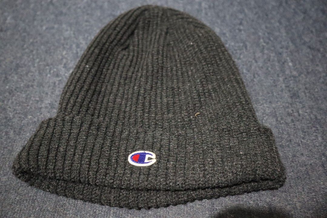 Champion Ribbed Knit Beanie Dark Grey (Category: Hats & Beanies) located in Manila. Submitted by lostandbos (Listing ID 1469264383, Image 2). Description: - Brand: Champion - Color: Dark grey - Details: Classic embroidered logo patch on foldover cuff - Material: Warm, thick ribbed knit - Condition: Clean and ready to wear - Style: Authentic American Athletic Apparel.