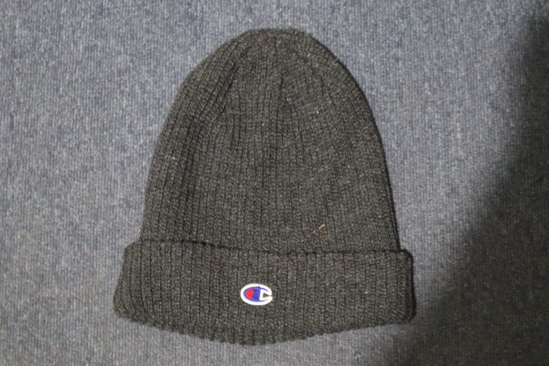 Champion Ribbed Knit Beanie Dark Grey (Category: Hats & Beanies) located in Manila. Submitted by lostandbos (Listing ID 1469264383, Image 1). Description: - Brand: Champion - Color: Dark grey - Details: Classic embroidered logo patch on foldover cuff - Material: Warm, thick ribbed knit - Condition: Clean and ready to wear - Style: Authentic American Athletic Apparel.