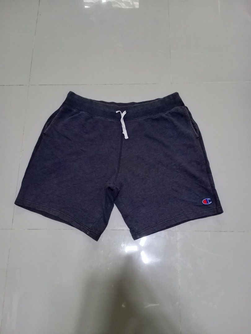 Champion sweat short size XL (Category: Shorts) located in Magdalena. Submitted by magdalenathrift20 (Listing ID 1469168409, Image 2). Description: - Brand: Champion (Made in Vietnam) - Color: Dark Grey - Size: XL (Waist: 40-50 inches, Length: 21 inches) - Material: Soft fleece fabric inside for maximum comfort - Features: Adjustable drawstring waistband, convenient side pockets, and classic embroidered Champion logo near the hem - Condition: Bra