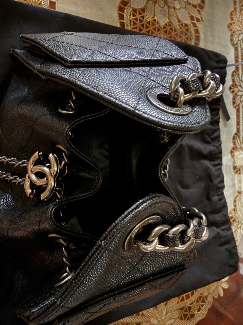 Chanel Black Caviar Leather Drawstring Handbag (Category: Luxury Bags & Wallets) located in Taguig. Submitted by kyliuh_ (Listing ID 1469180942, Image 3). Description: -Stunning ruthenium hardware and iconic interlocking CC logo front pocket - Secure drawstring main opening with interwoven chain and leather shoulder straps - Pristine black interior lining - Includes original dust bag -well-maintained condition -Unused and stored properly.