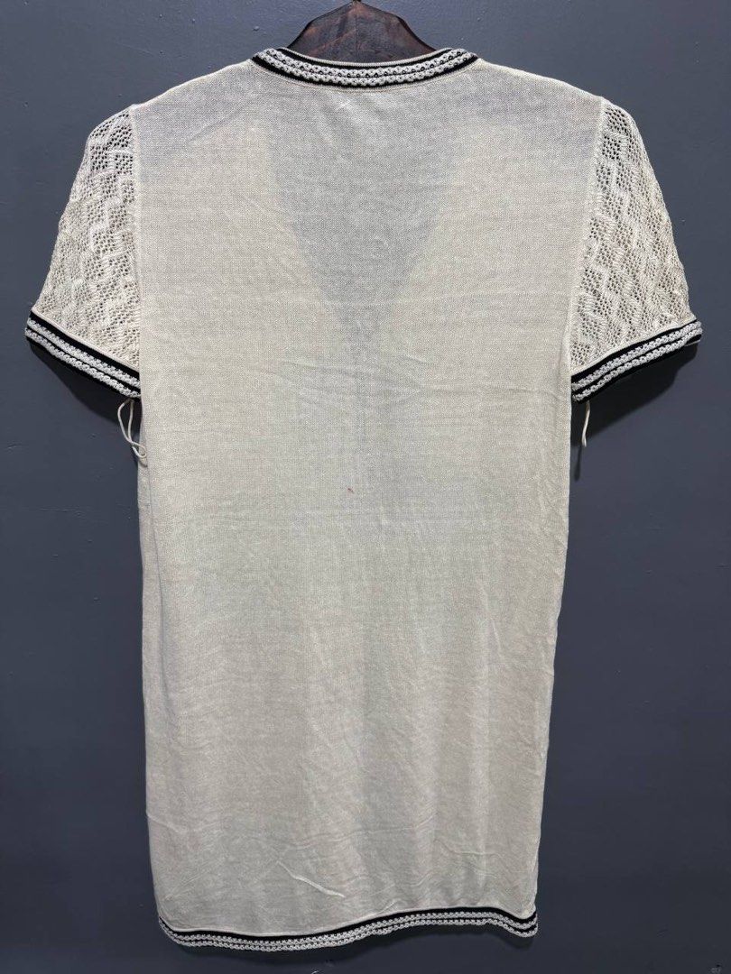 Chanel Vneck Knit Dress (Category: Dresses) located in Marikina City. Submitted by anndergroundmarket (Listing ID 1469164800, Image 2). Description: Chanel ivory and black vneck short-sleeve knit dress with four front patch pockets and crochet /stripe trim details..