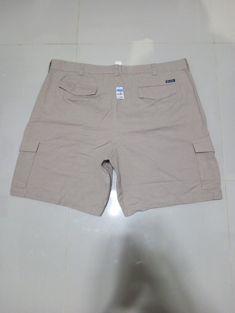 Chaps Cargo Shorts Size 46 (Category: Shorts) located in Magdalena. Submitted by magdalenathrift20 (Listing ID 1469168849, Image 3). Description: - Brand: Chaps - Color: Beige - Size: 46 (fits waistline 46" to 48") - Length: 23 inches - Closure: Button closure with belt loops - Pockets: Multiple functional pockets on sides and back - Fit: Standard casual fit, perfect for warm weather.