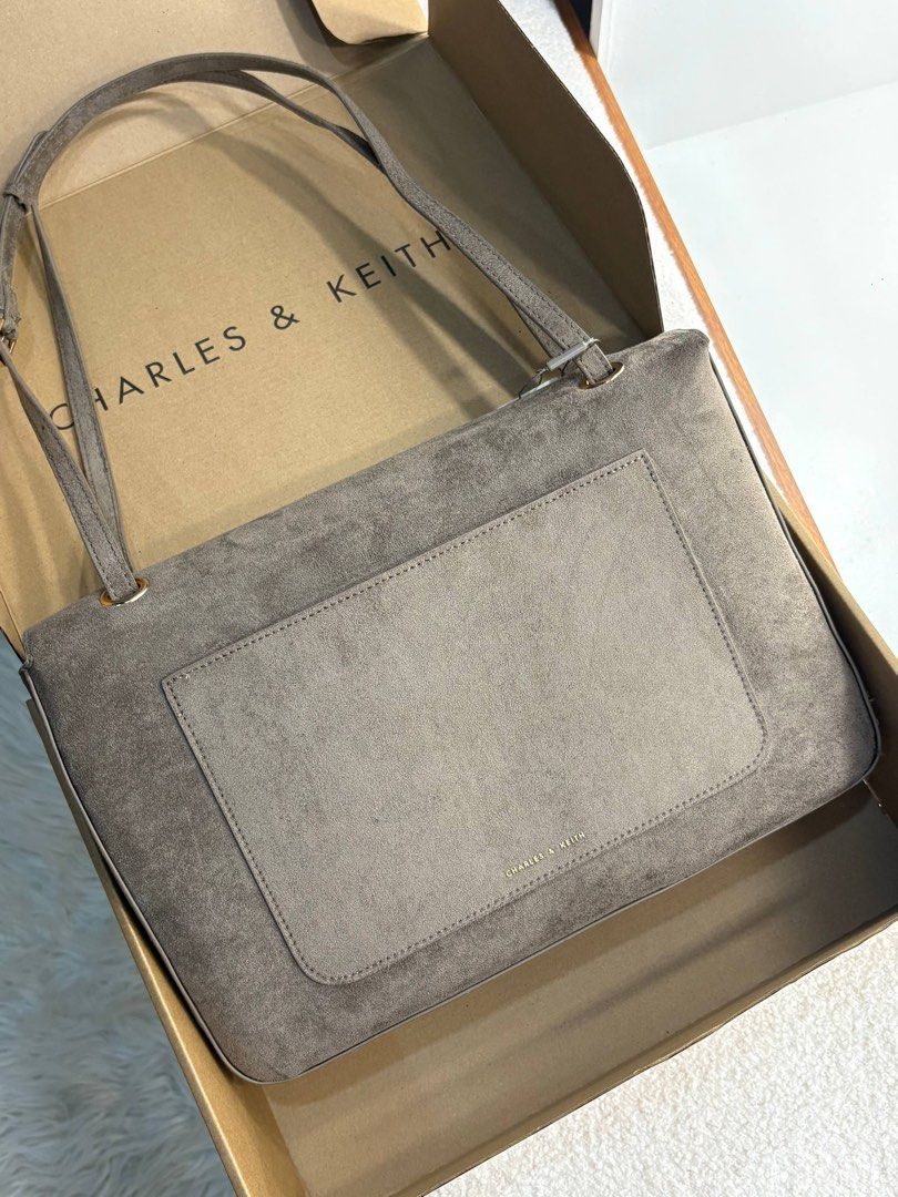 Charles & Keith Connie Shoulder Bag (Category: Shoulder Bags) located in Taguig. Submitted by 02ruedasrh20304 (Listing ID 1469286115, Image 2). Description: Charles & Keith Connie Quilted Shoulder bag available in Black, Pecan Brown, and Stone Gray. Structured design with a back slip pocket and dual shoulder straps. Interior fits a 13” laptop easily. Includes original branded box and store tag attached..