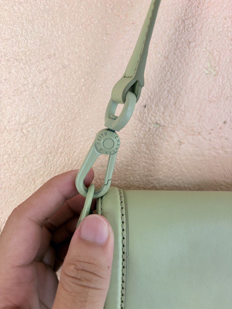 Charles & Keith Green Shoulder Bag (Category: Shoulder Bags) located in Pozorrubio. Submitted by zionegotthrift (Listing ID 1469198847, Image 3). Description: - Brand: Charles & Keith - Color: Green - Material: Genuine leather - Size: Medium (M) - Closure: Front flap with magnetic snap - Strap: Adjustable with lobster clasps - Details: Branded hardware, original tags still attached - Condition: Brand new.