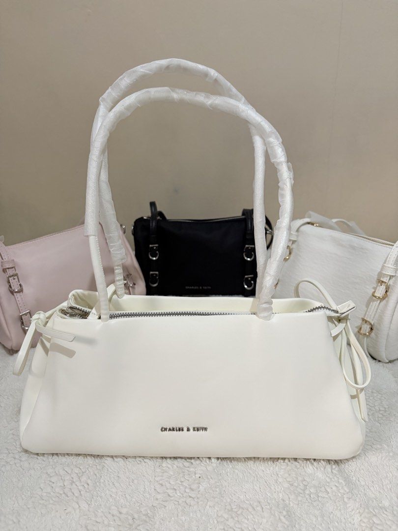 Charles and Keith Hazel Bow in white (Category: Shoulder Bags) located in Taguig. Submitted by 02ruedasrh20304 (Listing ID 1469276771, Image 1). Description: Charles and Keith Hazel Bow. Perfect for elegant and aesthetic outfits. Open for resellers! 🚚 Same day delivery thru Lalamove 📦 Nationwide delivery thru JnT PM to order 🛍️.