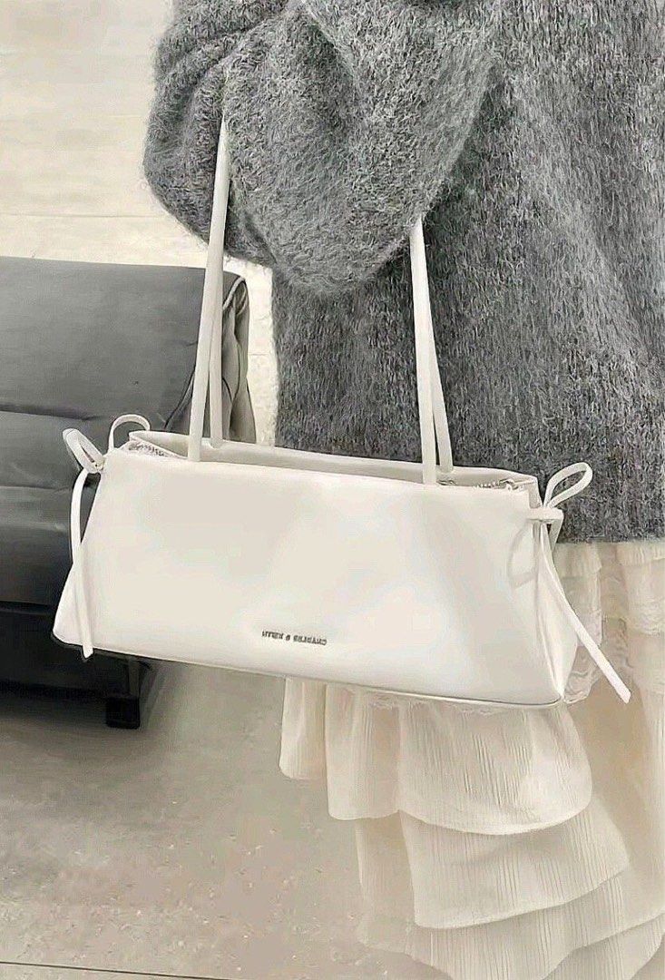 Charles and Keith Hazel Bow in white (Category: Shoulder Bags) located in Taguig. Submitted by 02ruedasrh20304 (Listing ID 1469276771, Image 3). Description: Charles and Keith Hazel Bow. Perfect for elegant and aesthetic outfits. Open for resellers! 🚚 Same day delivery thru Lalamove 📦 Nationwide delivery thru JnT PM to order 🛍️.