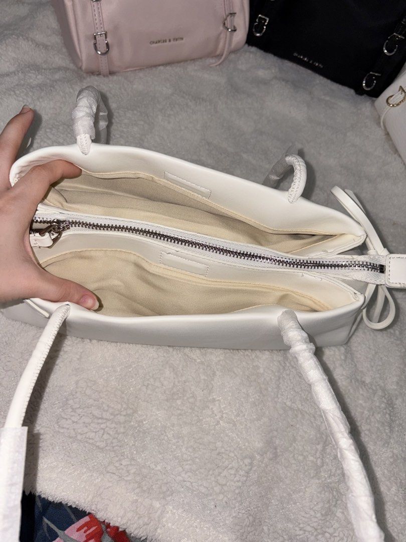 Charles and Keith Hazel Bow in white (Category: Shoulder Bags) located in Taguig. Submitted by 02ruedasrh20304 (Listing ID 1469276771, Image 2). Description: Charles and Keith Hazel Bow. Perfect for elegant and aesthetic outfits. Open for resellers! 🚚 Same day delivery thru Lalamove 📦 Nationwide delivery thru JnT PM to order 🛍️.