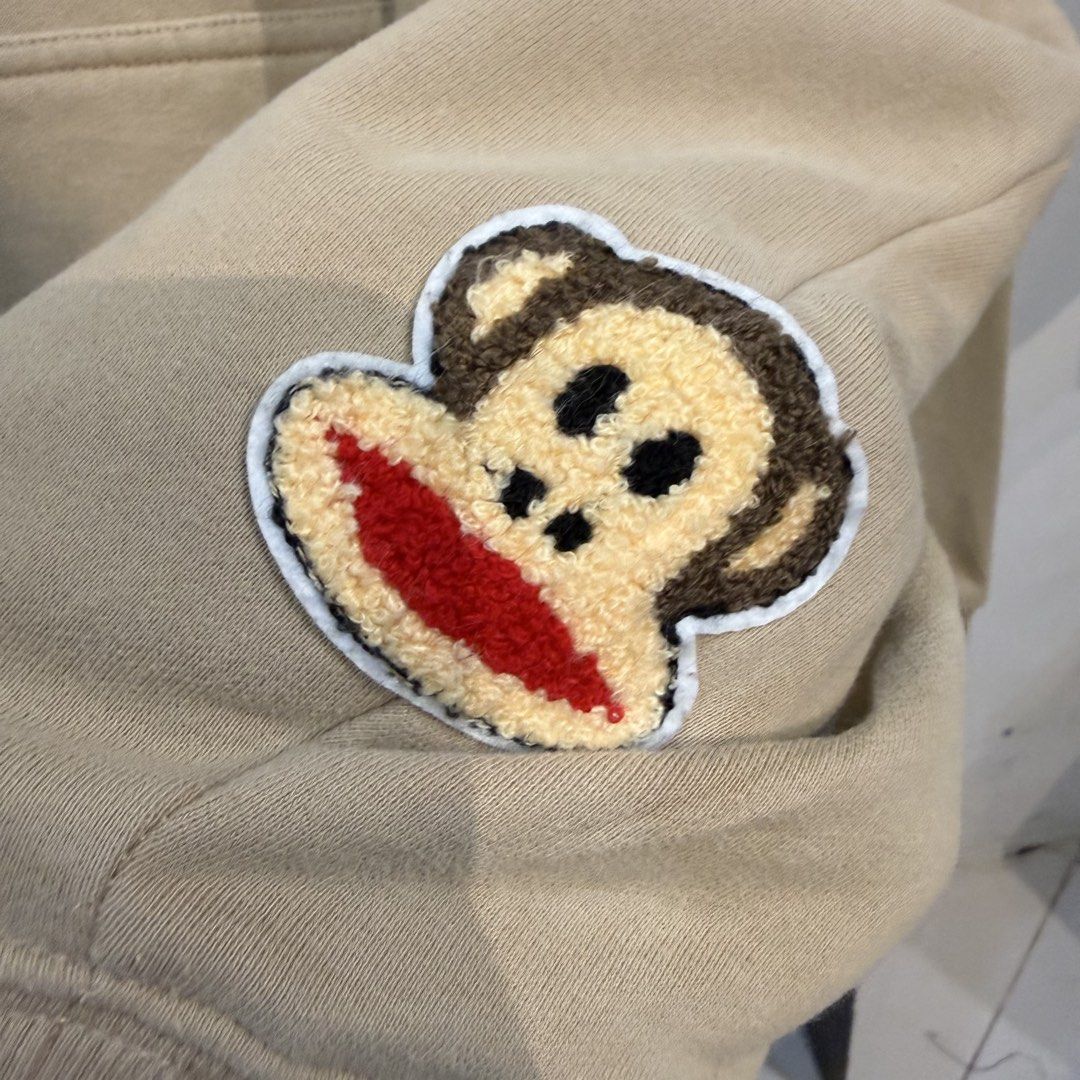 Chinism Beige Hoodie with Monkey Patch (Category: Coats, Jackets and Outerwear) located in Manila. Submitted by carbungcoalex (Listing ID 1469339751, Image 3). Description: CHINISM HOODIE 25 by 27.5 Good Condition Need wash 1K CLAIM.