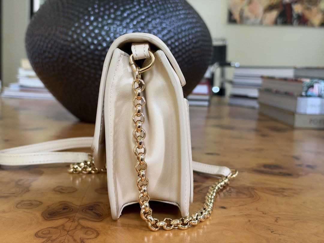 Chloé C Leather and Suede Shoulder Bag (Category: Luxury Bags & Wallets) located in Muntinlupa City. Submitted by katoshops (Listing ID 1469202008, Image 3). Description: Chloe C Chain Clutch Current Market Price: 1,190.00 USD Selling Price: ₱9,900.00 Condition: Very Good (8.5/10) Reason for Selling: Don’t get to use this bag. Additional Details: Color: Beige calfskin with gold hardware Worn: A few times Flaws: Gold-tone hardware has minor discol