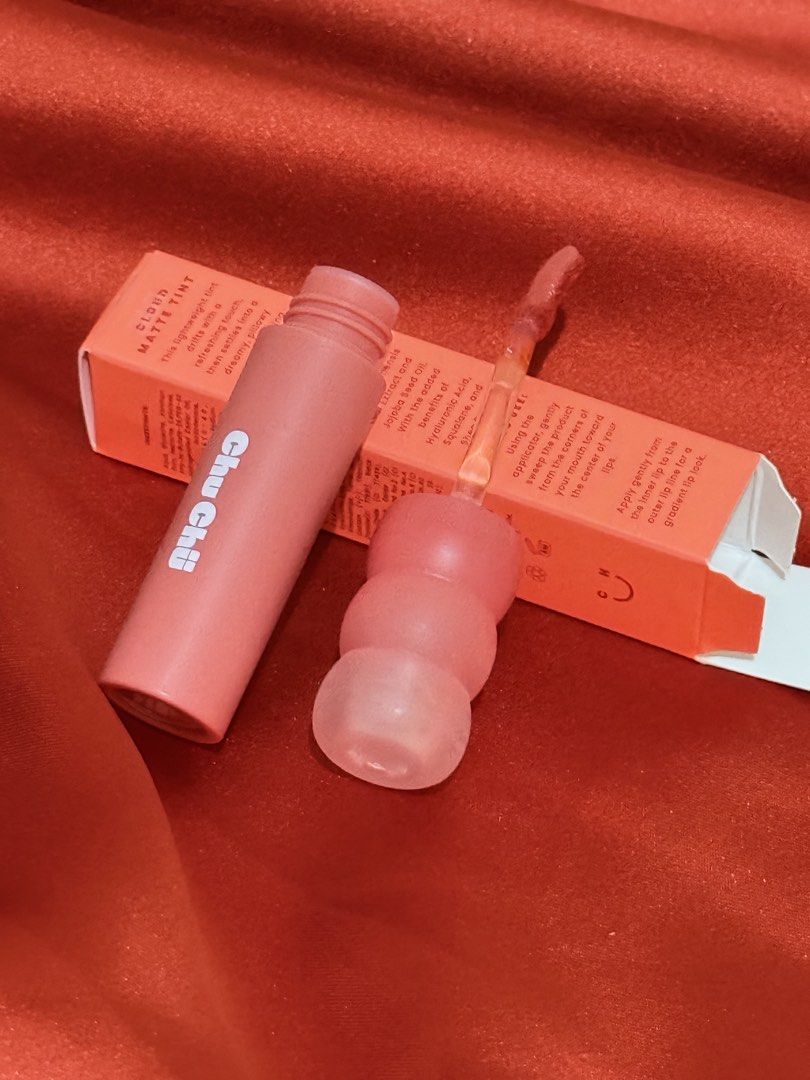 Chu Chu Cloud Matte Tint in Wisp (Category: Makeup) located in Iloilo. Submitted by wornwellco (Listing ID 1469165277, Image 3). Description: - Product: Chu Chu Cloud Matte Tint - Shade: Wisp (Ember Peach) - Condition: Brand new, unused (packaging opened for photos only) - Formula: Lightweight, pillowy matte finish with jojoba seed oil, hyaluronic acid, squalane, and shea butter - Inclusions: Comes with original box and applicator brush.