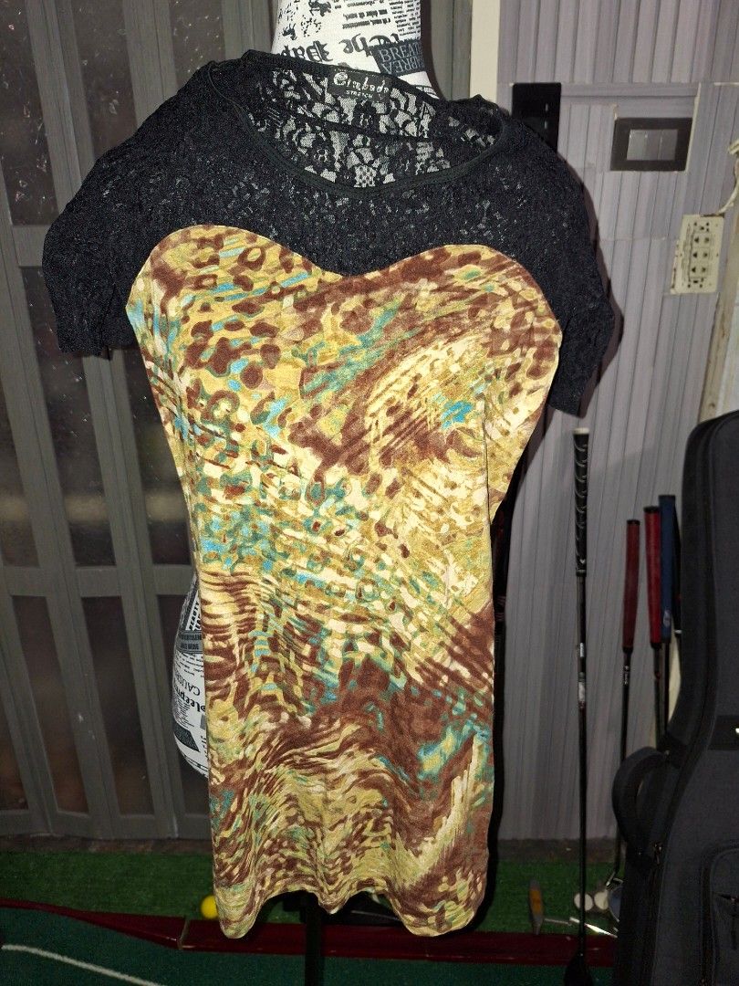 Cinbada Black Lace and Patterned Top (Category: Blouses) located in Manila. Submitted by mialiurshop (Listing ID 1469228845, Image 1). Description: - Brand: Cinbada - Design: Black lace top with a vibrant colorful abstract front panel - Fit: Comfortable round neckline and short sleeves with stretch - Material: Lightweight and breathable fabric - Styling: Versatile piece, easy to pair with your favorite jeans or skirts.