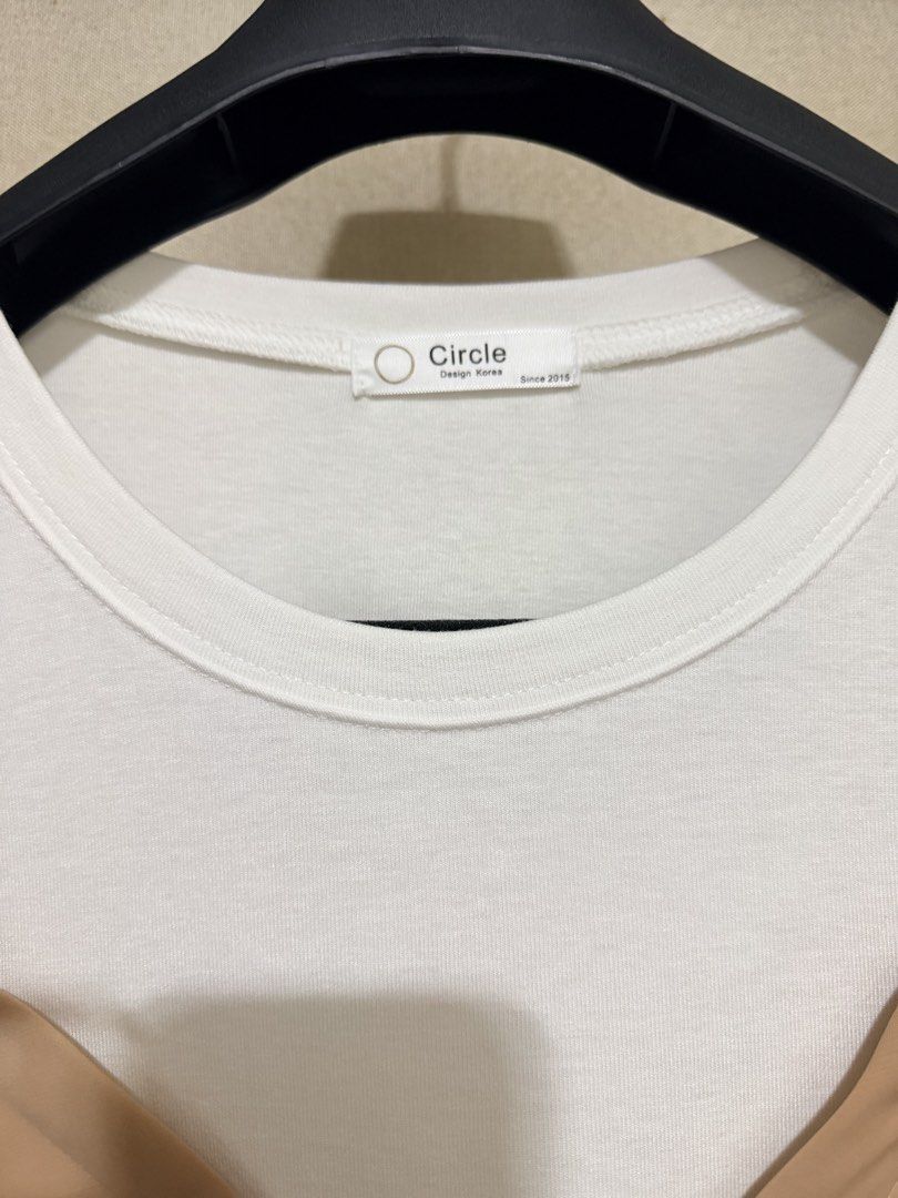 Circle Design Korea Layered White Tee With Nude Cami (Category: Shirts) located in Cavite. Submitted by mgd.blessed (Listing ID 1469307916, Image 2). Description: - Brand/Origin: Circle Design Korea - Design: White short-sleeve tee with an attached nude brown slip camisole overlay - Features: V-neck cami design with adjustable thin straps - Style: Versatile and made for effortless matching - Condition: Clean, no flaws found.