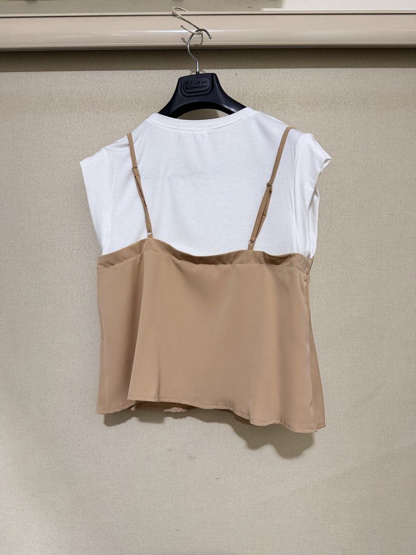 Circle Design Korea Layered White Tee With Nude Cami (Category: Shirts) located in Cavite. Submitted by mgd.blessed (Listing ID 1469307916, Image 3). Description: - Brand/Origin: Circle Design Korea - Design: White short-sleeve tee with an attached nude brown slip camisole overlay - Features: V-neck cami design with adjustable thin straps - Style: Versatile and made for effortless matching - Condition: Clean, no flaws found.