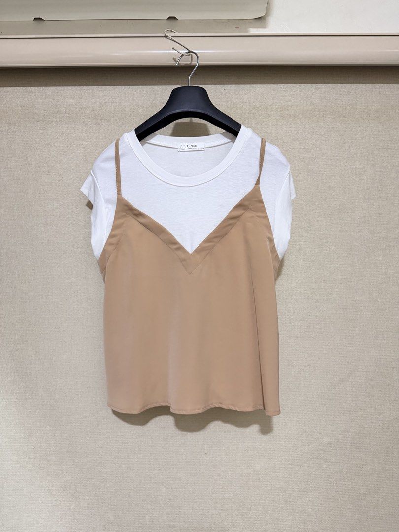 Circle Design Korea Layered White Tee With Nude Cami (Category: Shirts) located in Cavite. Submitted by mgd.blessed (Listing ID 1469307916, Image 1). Description: - Brand/Origin: Circle Design Korea - Design: White short-sleeve tee with an attached nude brown slip camisole overlay - Features: V-neck cami design with adjustable thin straps - Style: Versatile and made for effortless matching - Condition: Clean, no flaws found.
