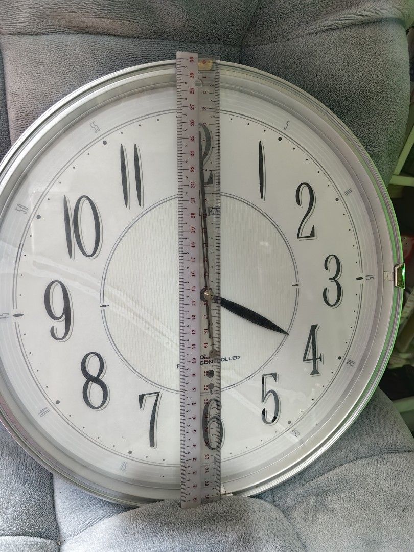 Citizen Radio Controlled Wall Clock (Category: Clocks) located in Rizal. Submitted by gkstcenit (Listing ID 1469171026, Image 2). Description: Take all 3pcs for 1000 Brand: Citizen Radio-Controlled Wall Clock - Design: Classic analog style with a clean face and large, easy-to-read numbers - Color/Finish: Round shape with a stylish green and silver trim - Size: Approximately 30 cm in diameter - Power: Battery-operated (battery compartment on the b