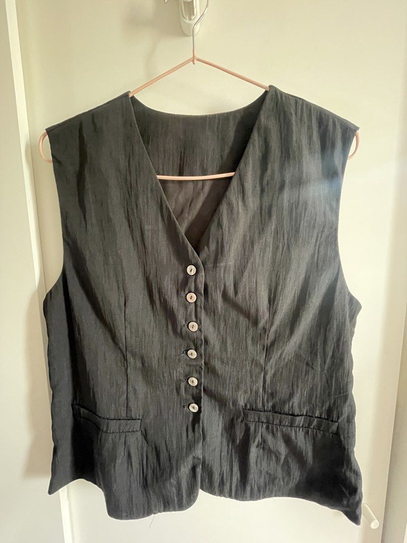 Classic Black Button-Up Waistcoat Vest (Category: Sleeveless) located in Agdangan. Submitted by happyphoenix.d92869 (Listing ID 1469211816, Image 1). Description: - Unisex - Color: Classic Black - Size: fits m to l - Style: Sleeveless waistcoat vest with V-neck - Details: Functional front buttons and two front pockets - Fit: Standard fit with classic tailoring - Versatility: Easy to layer over shirts or wear solo for a chic look.