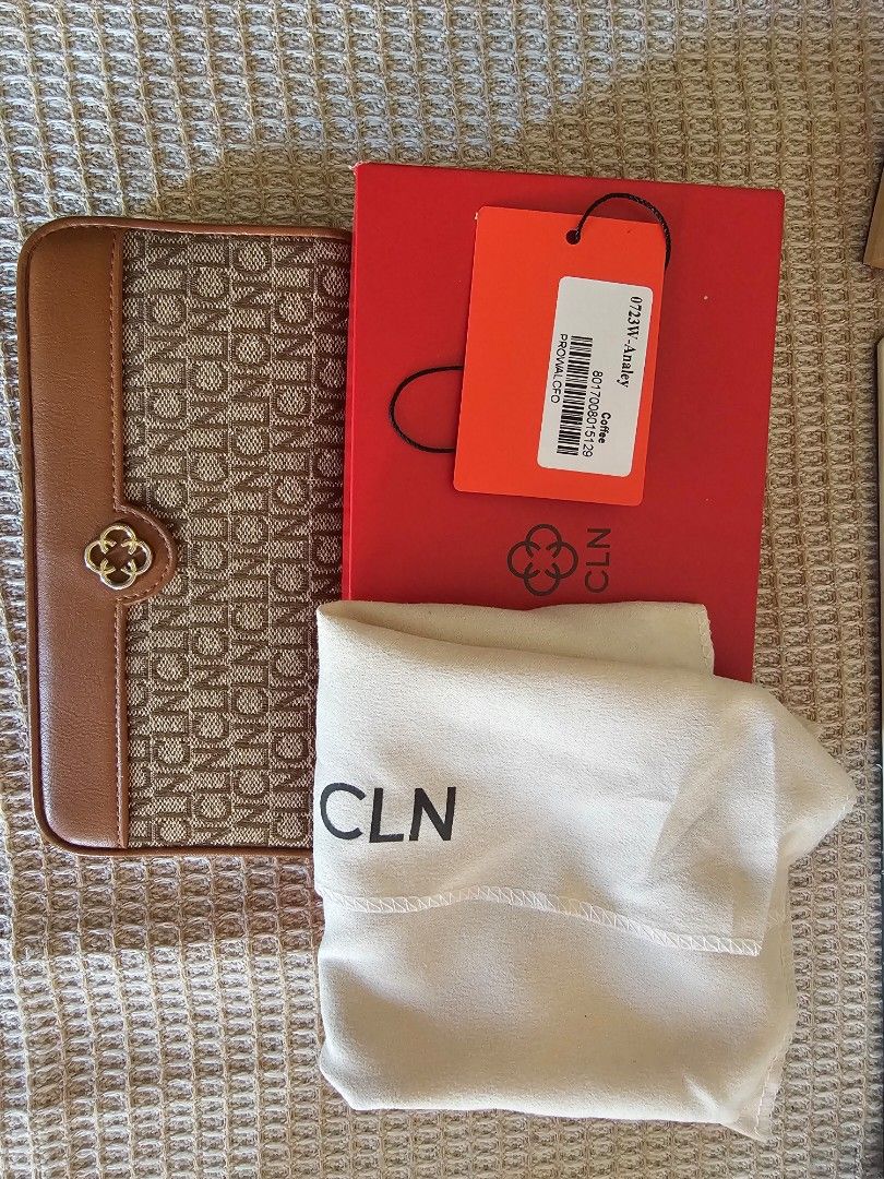 CLN Analey Long Wallet Coffee (Category: Wallets & Card holders) located in San Pablo. Submitted by anicahclosetonlineshop (Listing ID 1469293378, Image 1). Description: - Brand: CLN - Model: 0723W-Analey - Color: Coffee with brown trim (Monogram pattern) - Closure: Snap button - Interior: Multiple card slots and a zippered coin pocket - Condition: Brand new, never used, properly stored - Inclusions: Original red box and dust bag.