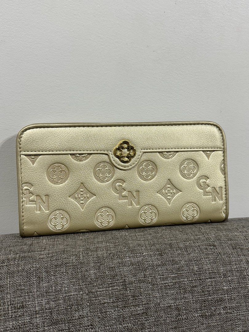 CLN Gold Embossed Long Wallet (Category: Wallets & Card holders) located in Manila. Submitted by justkayemarana (Listing ID 1469245634, Image 1). Description: - Brand: CLN - Color: Elegant Gold - Condition: Brand new (w box) - MOP: bank transfer or gcash - meetup: around bgc area only - shipping: via grab or lalamove (shipping will be shouldered by the buyer) pm for more inquiries!! :).