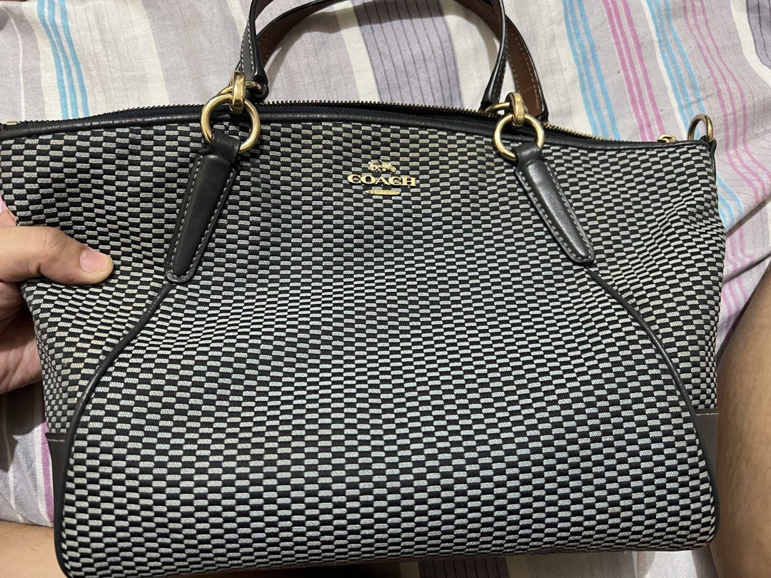 Coach 2-way handbag black bag (Category: Luxury Bags & Wallets) located in Navotas City. Submitted by maxspreloved (Listing ID 1469185832, Image 1). Description: Coach 2-way handbag (has a sling!) Authentic from the States Condition: 8.5/10 RFS: decluttering.