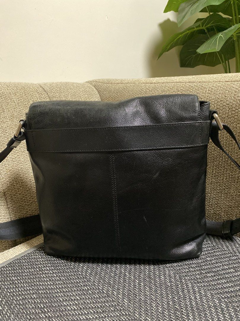 Coach Black Leather Messenger Bag (Category: Sling Bags) located in Pagadian. Submitted by everbeauxsacs (Listing ID 1469306297, Image 3). Description: - Authentic Coach messenger bag in classic black pebble leather - Secure flap closure with strong magnetic snaps - Comfortable adjustable fabric shoulder strap for easy carrying - Spacious main compartment with interior zip and slip pockets - Durable fabric lining and premium genuine leather const