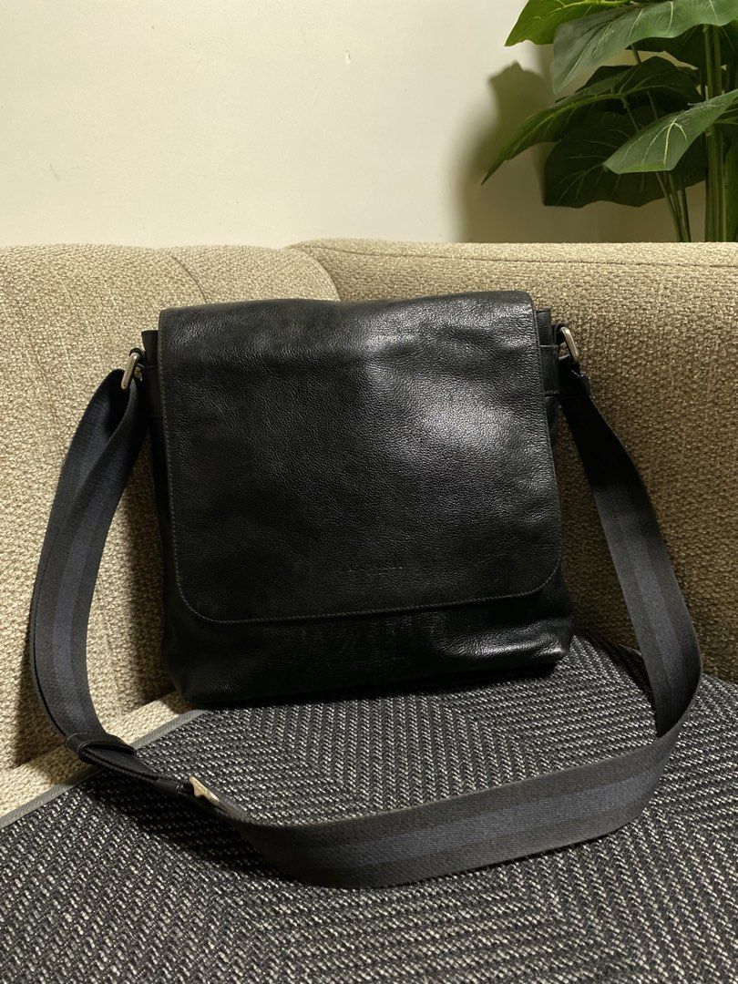 Coach Black Leather Messenger Bag (Category: Sling Bags) located in Pagadian. Submitted by everbeauxsacs (Listing ID 1469306297, Image 1). Description: - Authentic Coach messenger bag in classic black pebble leather - Secure flap closure with strong magnetic snaps - Comfortable adjustable fabric shoulder strap for easy carrying - Spacious main compartment with interior zip and slip pockets - Durable fabric lining and premium genuine leather const
