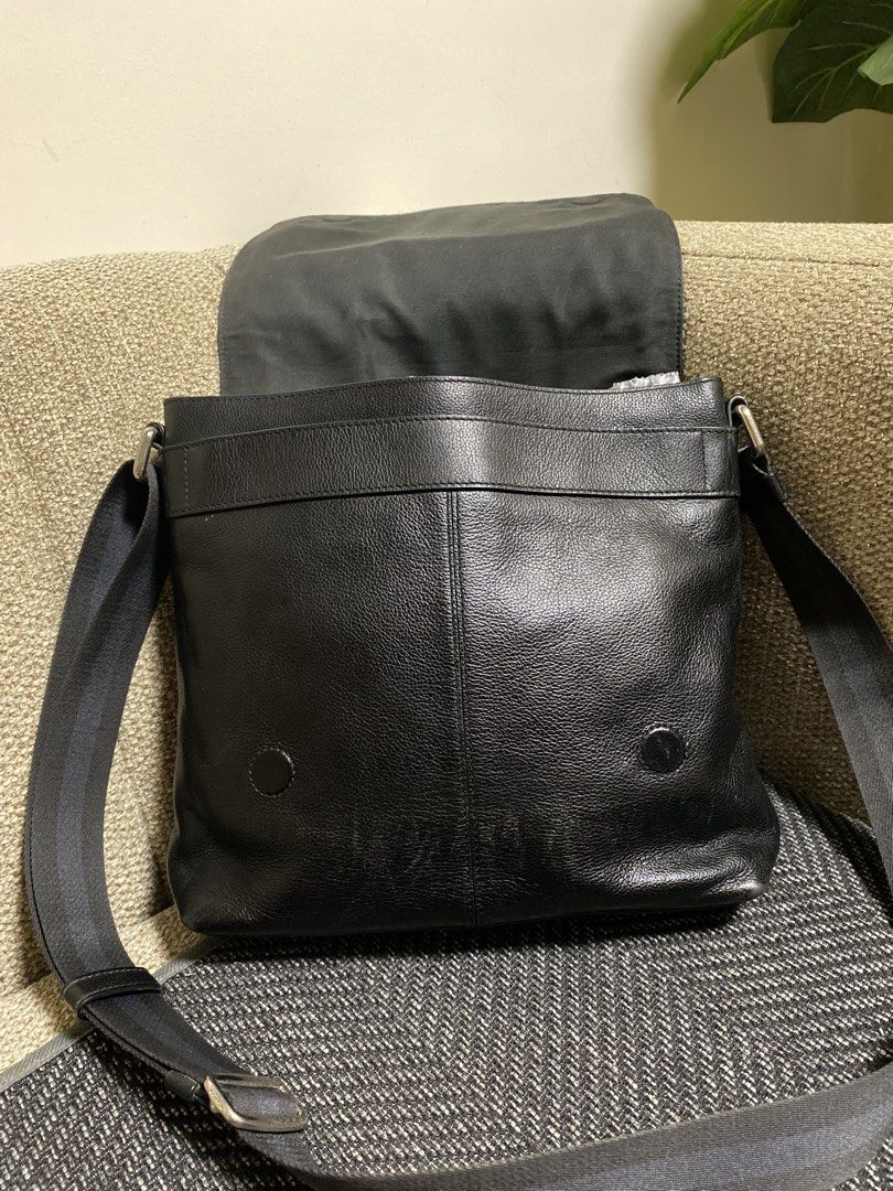 Coach Black Leather Messenger Bag (Category: Sling Bags) located in Pagadian. Submitted by everbeauxsacs (Listing ID 1469306297, Image 2). Description: - Authentic Coach messenger bag in classic black pebble leather - Secure flap closure with strong magnetic snaps - Comfortable adjustable fabric shoulder strap for easy carrying - Spacious main compartment with interior zip and slip pockets - Durable fabric lining and premium genuine leather const