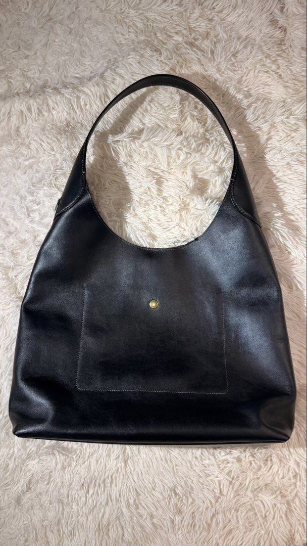 Coach Brooklyn Shoulder Bag (Category: Luxury Bags & Wallets) located in Pasay City. Submitted by erinsclosetph (Listing ID 1469217620, Image 2). Description: Coach Brooklyn black leather shoulder bag Gold-tone metallic lettering on front. Buttery soft and slouchy silhouette. Fits 15-inch laptop. Perfect work bag. Color: Black Size: 39 Condition: Excellent pre-loved condition with minimal signs of wear and a clean suede interior. Inclusions: Orig