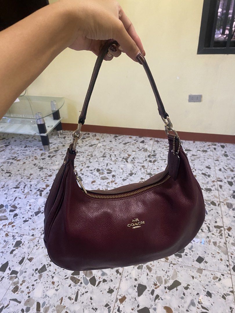 Coach Leather Maroon Shoulder Bag (Category: Luxury Bags & Wallets) located in Cabanatuan. Submitted by itsajest (Listing ID 1469233434, Image 1). Description: 🍷 FOR SALE: VINTAGE COACH HOBO BAG 👜✨ Coach Bailey Hobo or Coach Harley Hobo Bag Type: Vintage bag Color: Burgundy 🍷 Condition: With signs of fading and scratches Zippers: All intact and working Inclusions: Hangtag and sling bag 📌 Legit and authentic Coach bag! 💌 DM me for condition d