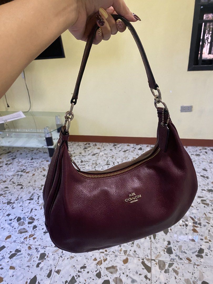 Coach Leather Maroon Shoulder Bag (Category: Luxury Bags & Wallets) located in Cabanatuan. Submitted by itsajest (Listing ID 1469233434, Image 3). Description: 🍷 FOR SALE: VINTAGE COACH HOBO BAG 👜✨ Coach Bailey Hobo or Coach Harley Hobo Bag Type: Vintage bag Color: Burgundy 🍷 Condition: With signs of fading and scratches Zippers: All intact and working Inclusions: Hangtag and sling bag 📌 Legit and authentic Coach bag! 💌 DM me for condition d